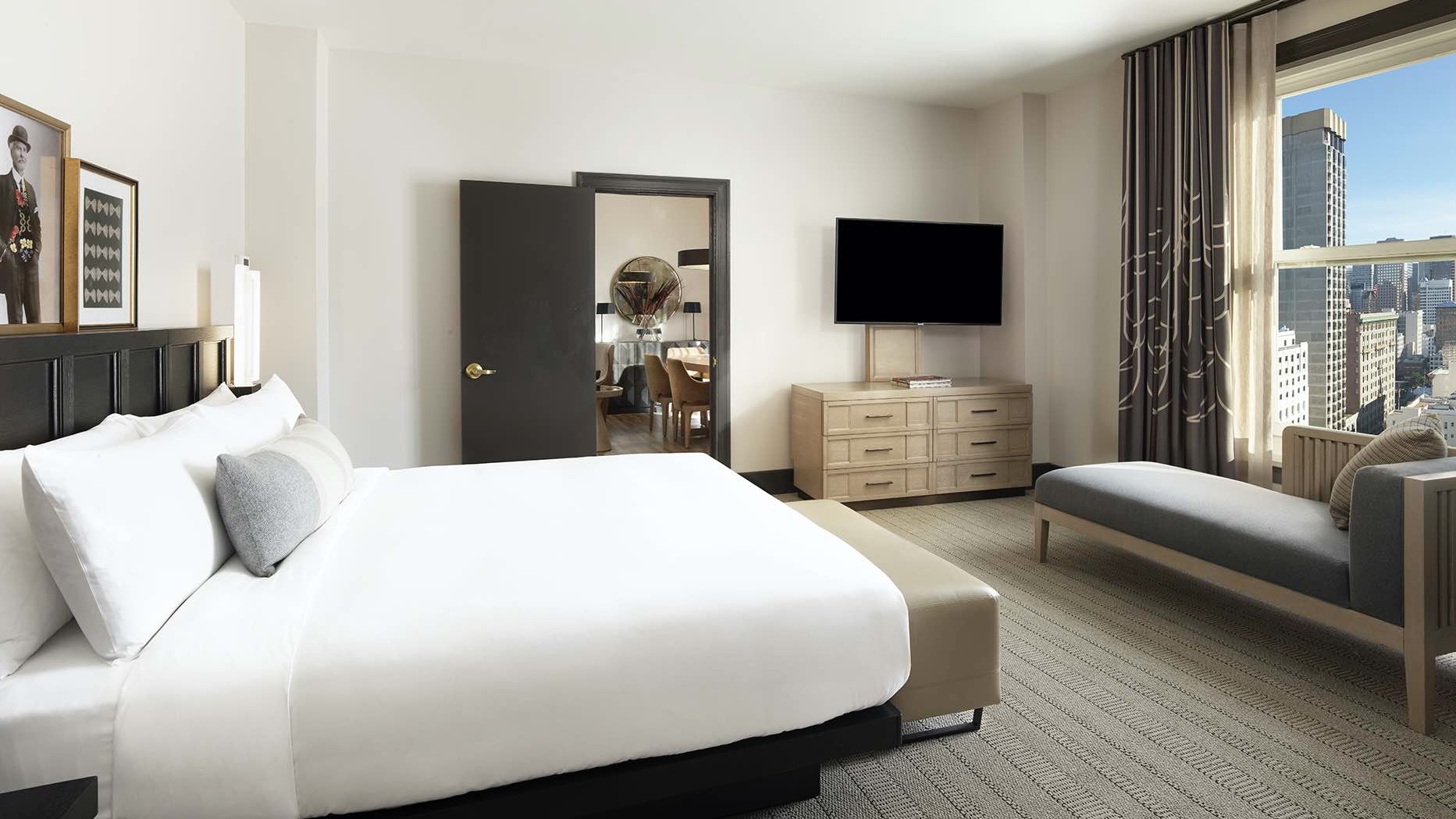Deluxe Suite Bedroom with adjoining room and city view at The Clift Royal Sonesta Hotel